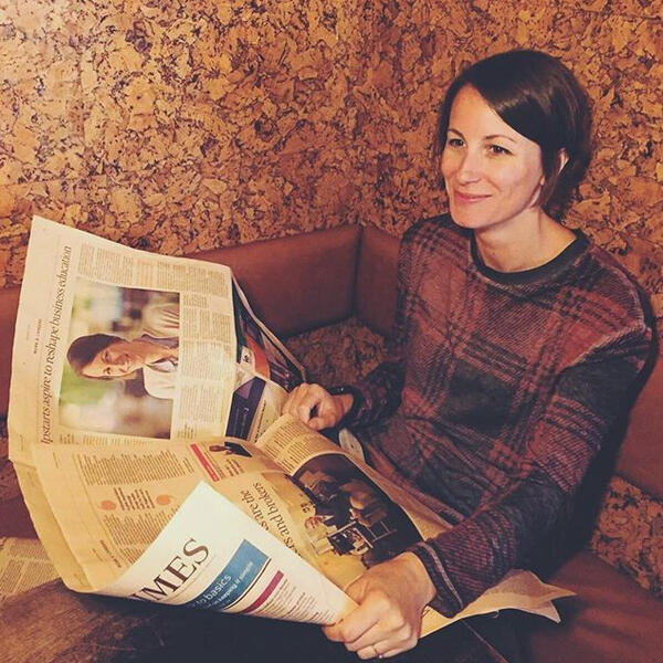 Photo of Aimee holding Financial Times with her picture in